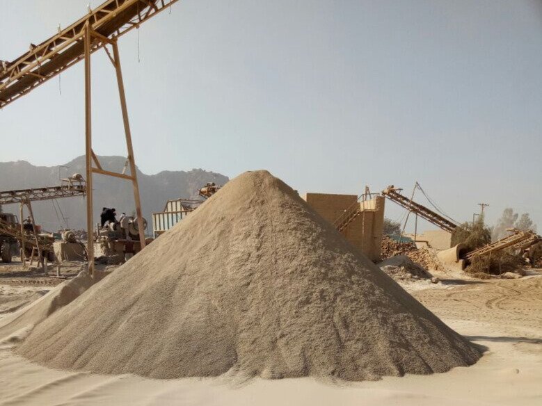 Stonedust Sargodha Brown fine crushed stone powder, quality construction material for plaster, block making, flooring, and surface finishing in Pakistan.
