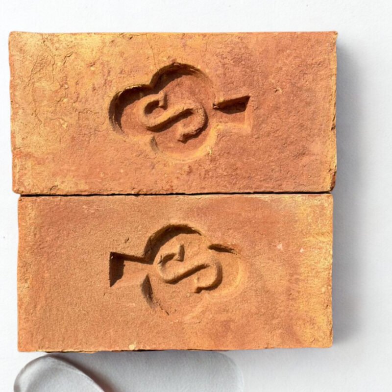 S Marka Awwal A Grade red clay bricks arrow stamp on white background